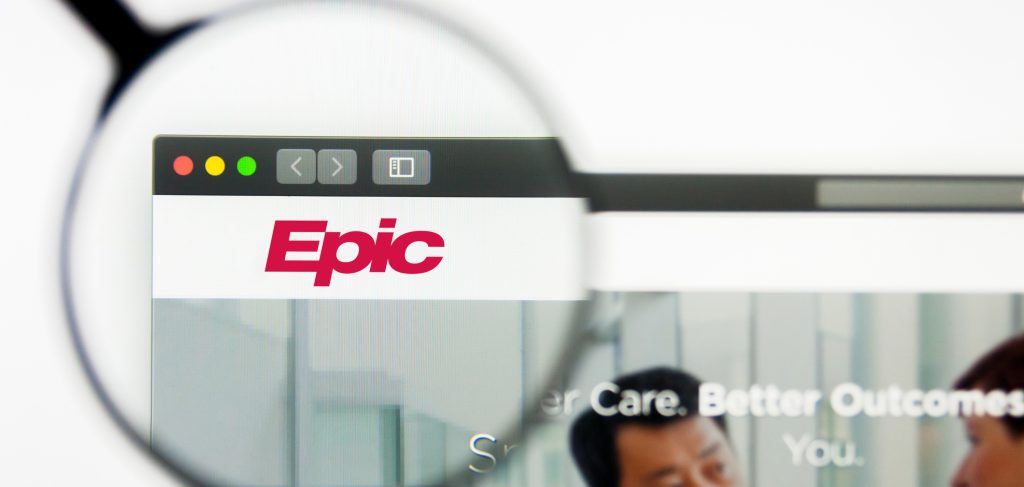 A magnifying glass zoomed in on the Epic Software logo. This helps show that InTegrum Resources provides Epic Software Consulting